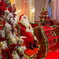 Santa Claus seated in his sleigh at Christmas Fairies