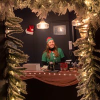 The welcoming smile of a little elf at the entrance of Christmas Fairies
