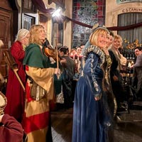 Troubadour and minstrel atmosphere at a medieval dinner.